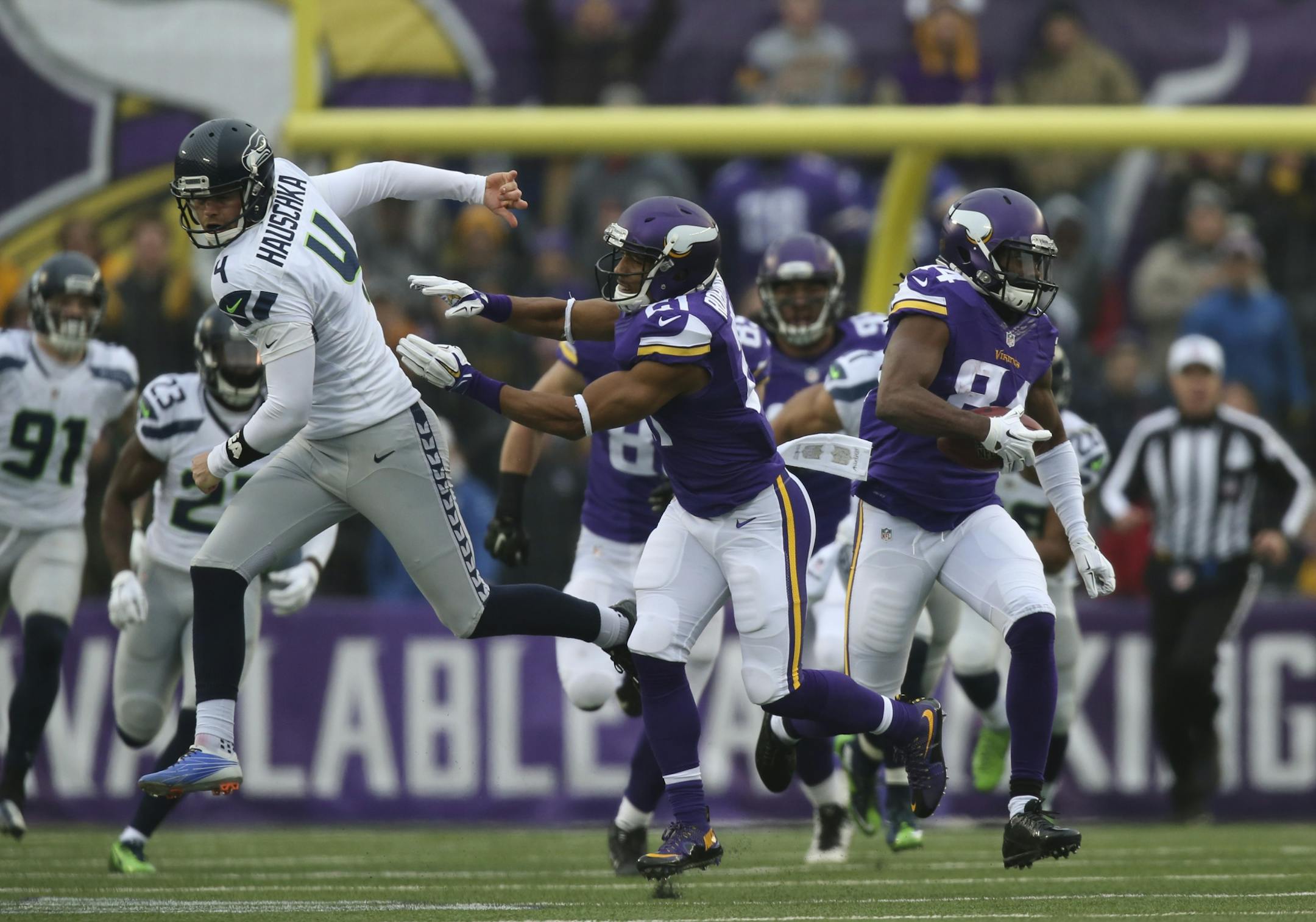 A key block by Vikings cornerback Josh Robinson (21) took out Seahawks kicker Steven Hauschka (4) and the only obstacle left in Vikings wide receiver Cordarrelle Patterson's way, as he ran a third quarter kickoff back 101 yards for the Vikings only score Sunday.