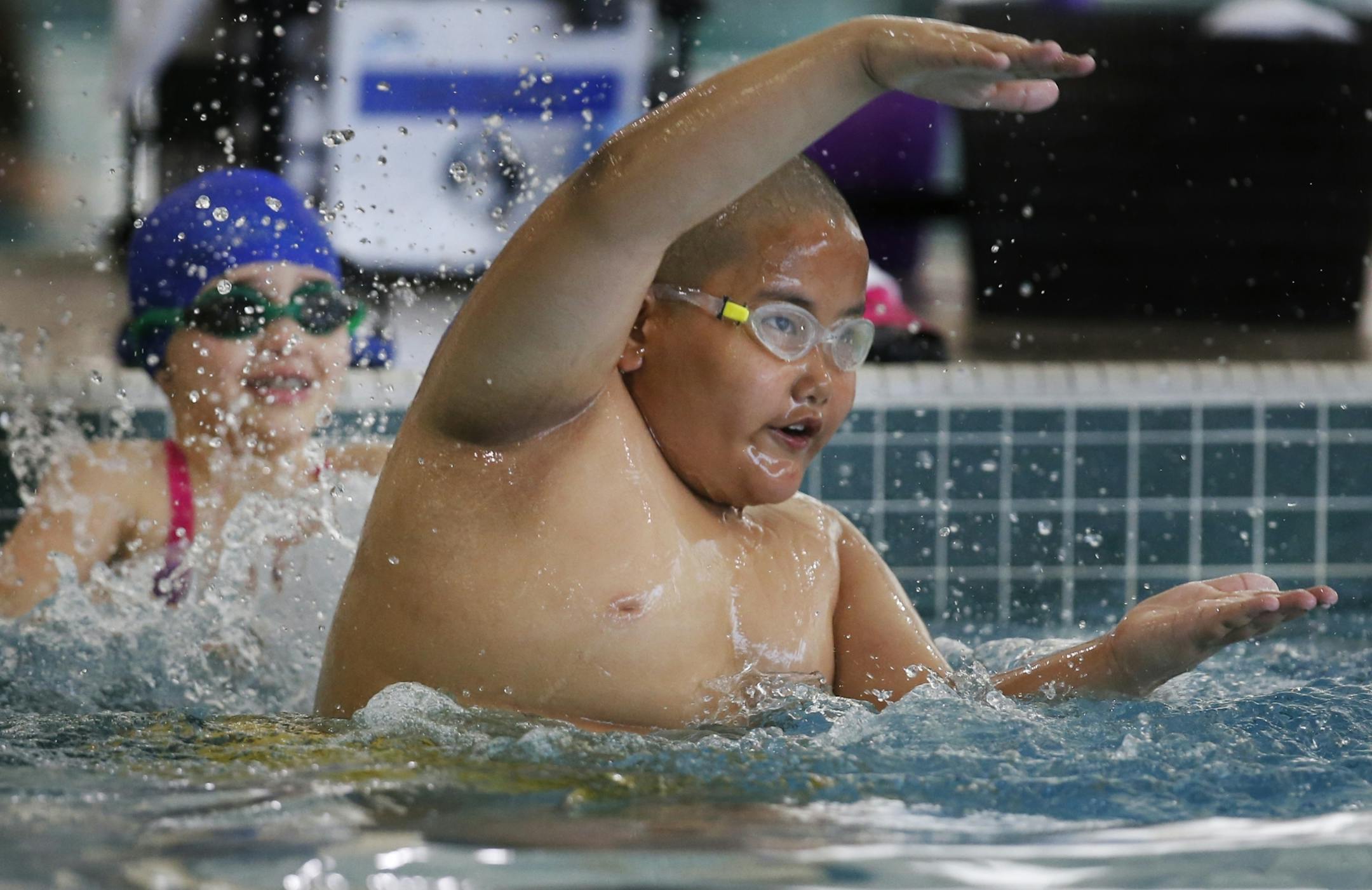 Jalue Dorjee,9, takes a swim class on Saturdays at the Lifetime Fitness in Fridley.