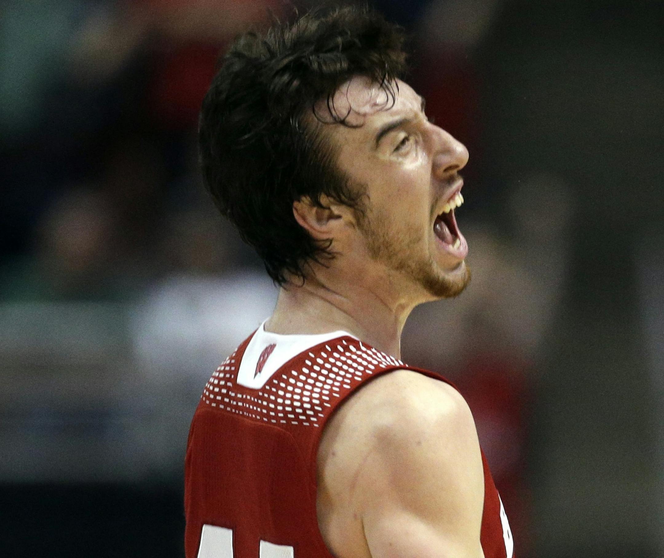 Wisconsin 's Frank Kaminsky reacts after making a three-point basket during the second half in a regional final NCAA college basketball tournament game against Arizona, Saturday, March 29, 2014, in Anaheim, Calif. (AP Photo/Jae C. Hong)