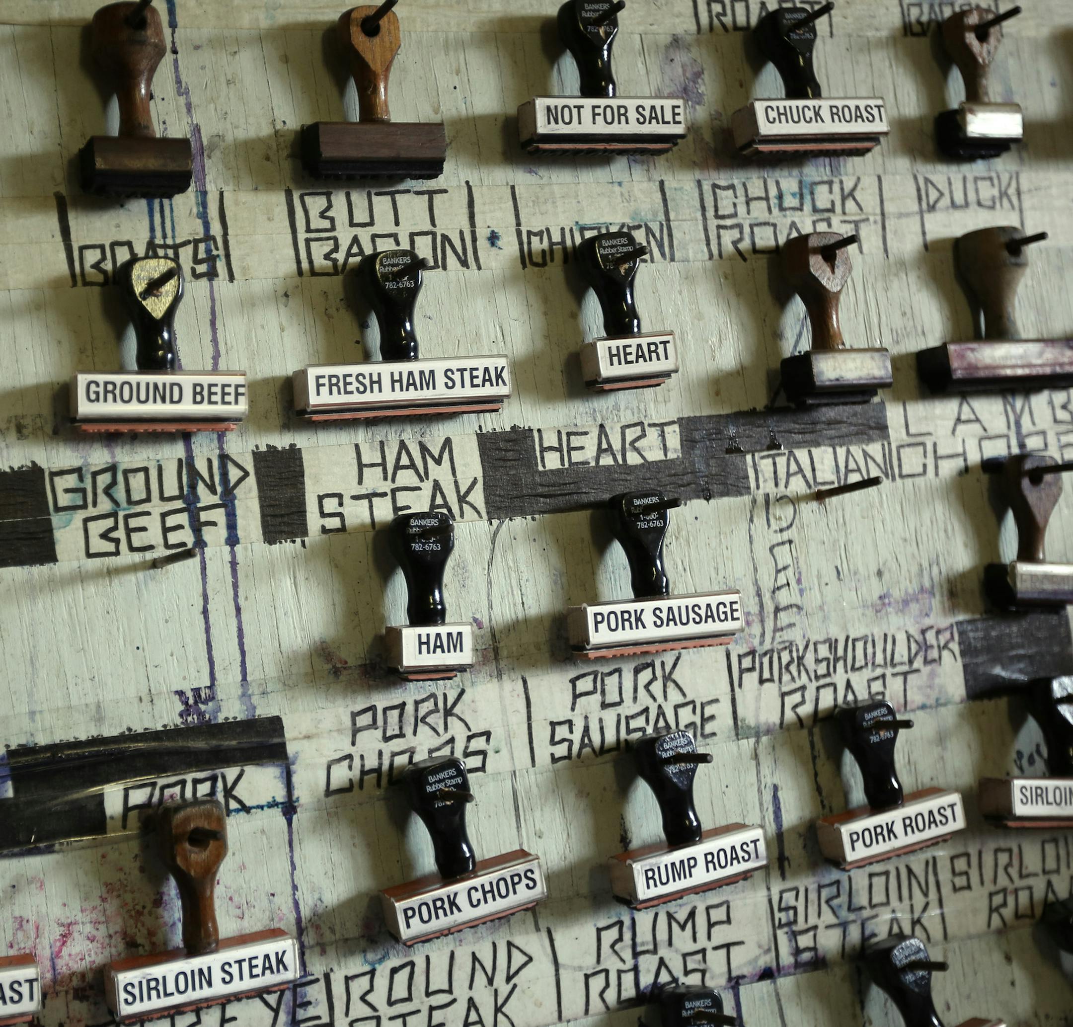 Inmates used rubber stamps to identify the different cuts of meats they process.