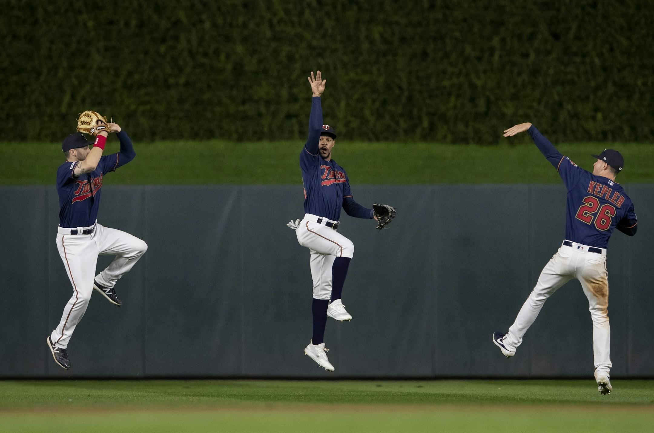 Minnesota Twins outfielders Jake Cave, Byron Buxton and Max Kepler celebrate at the end of the game on April 29, 2019 at Target Field in Minneapolis, Minn. The Twins won, 1-0.