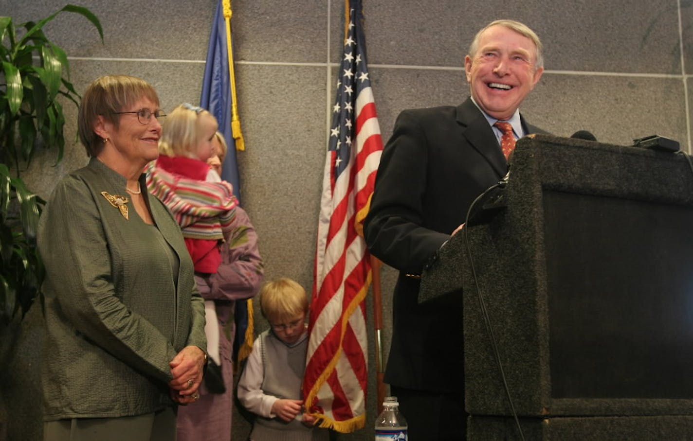 Congressman Martin Olav Sabo laughed during a pressconference where he announced he was retiring this year (2006). He said he was looking forward to spending more time with his wife Sylvia (at left), children and grandchildren (pictured behind him).