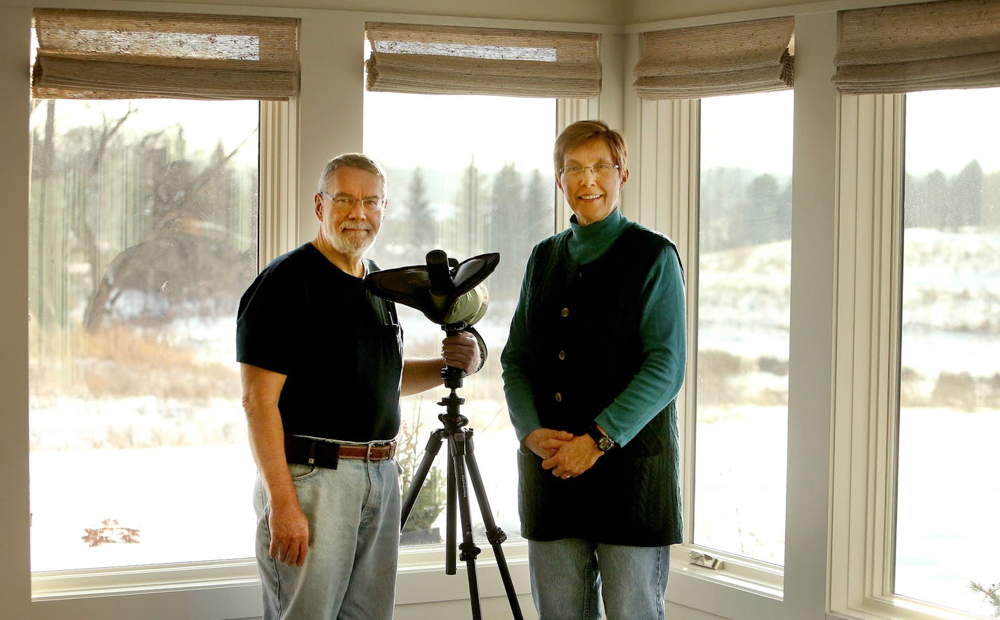 The couple set up a spotting scope in the sunroom.