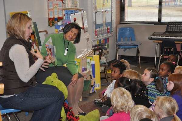 State Education Commissioner Brenda Cassellius, upper right, participated in a student reading event last November in the Burnsville-Eagan-Savage scho
