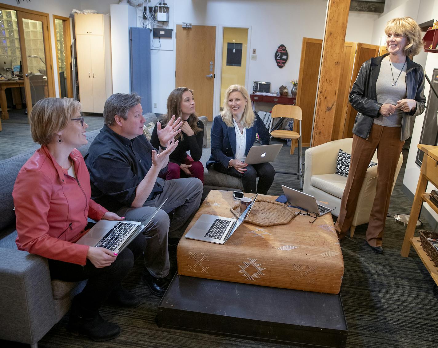 Susan Evans, founder of Evans Larson Communications, with company leaders Elizabeth Pavlica, Paul Konrardy, Margo Hileman and Teresa McFarland.