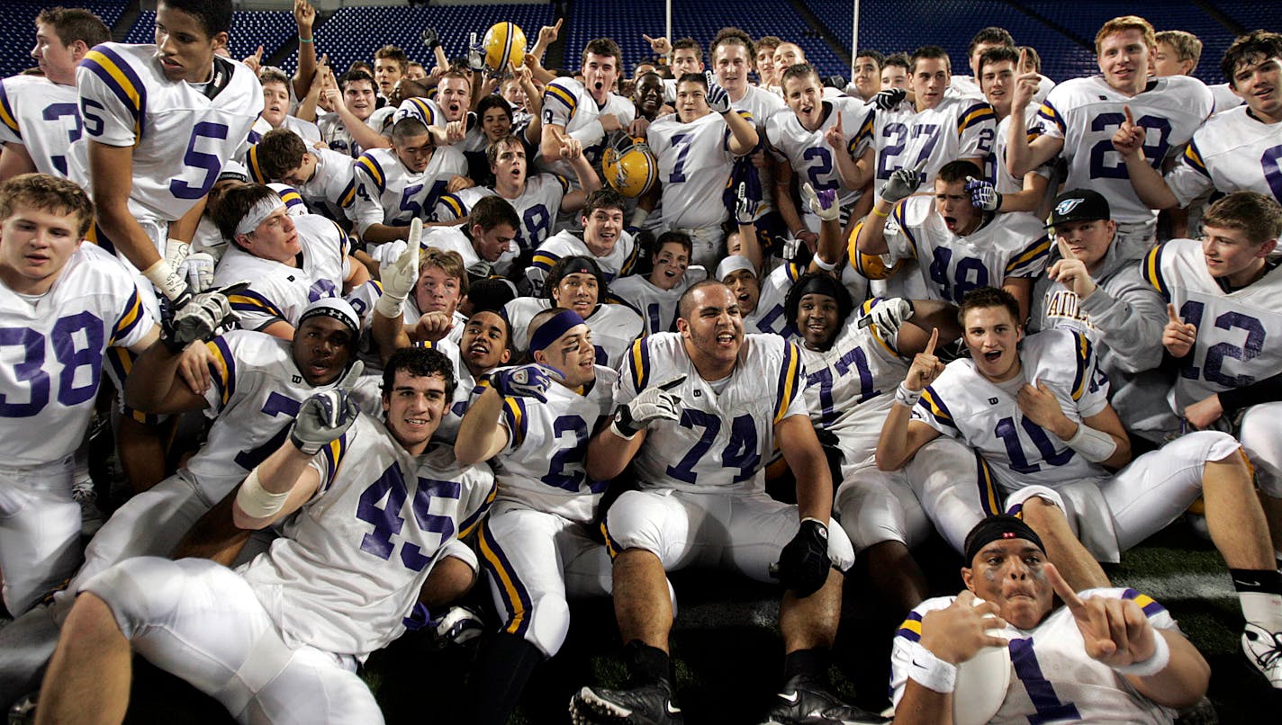 JIM GEHRZ ¥ jgehrz@startribune.com Minneapolis/November 27, 2009/7:00 PM] Members of the Cretin-Derham Hall football team posed for a team photograph after defeating Eden Prairie 16-5 to win the Class 5A championship at the Minnesota State High School Football Tournament at the Metrodome.