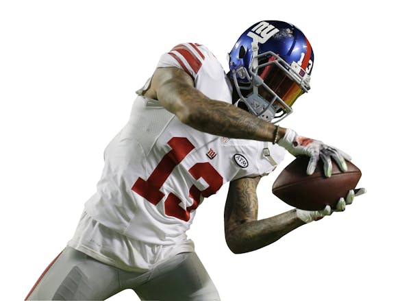 New York Giants wide receiver Odell Beckham (13) makes a catch before an NFL football game against the Miami Dolphins, Monday, Dec. 14, 2015, in Miami