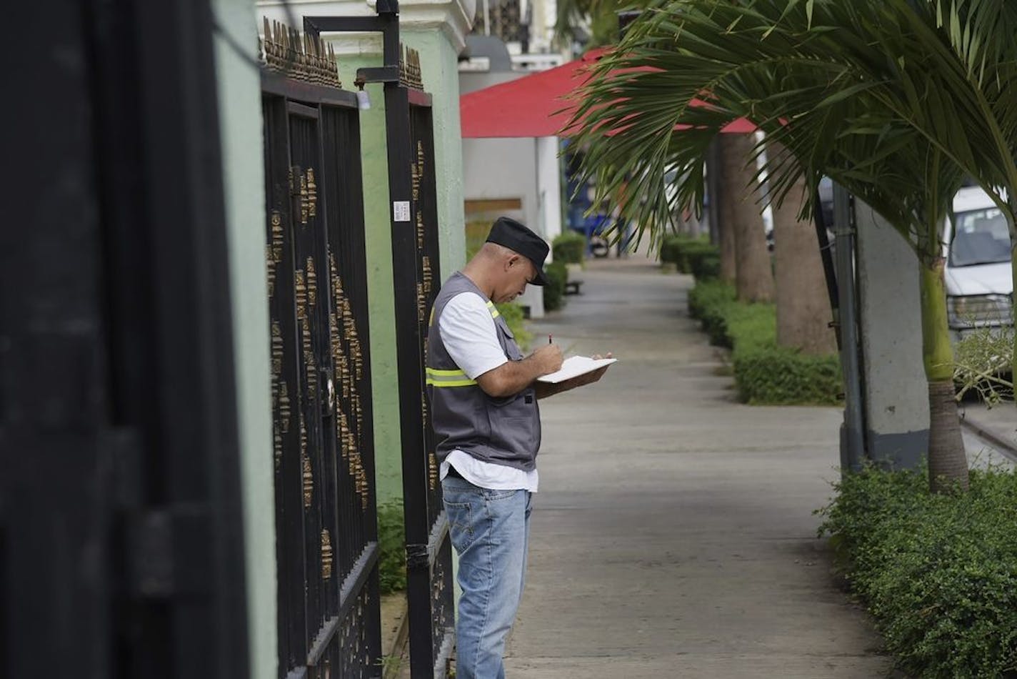 An investigative police officer takes notes outside the Dial Bar and Lounge where former Boston Red Sox slugger David Ortiz was shot inside the previous night in Santo Domingo, Dominican Republic, Monday, June 10, 2019. Dominican National Police Director Ney Aldrin Bautista Almonte said Ortiz was at the bar around 8:50 p.m. Sunday when a gunman approached from behind and shot him at close range.