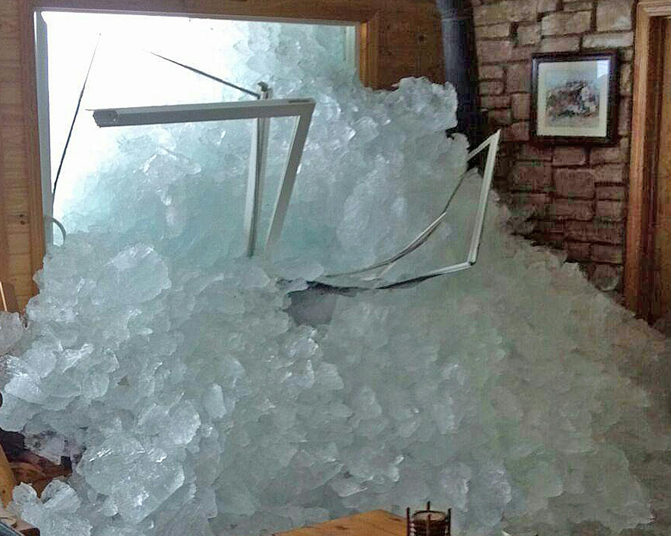 The living room of Randy Dykhoff's property shows the damage from the wind-swept ice off Lake Mille Lacs. Dykhoff said he carried several wheelbarrow loads of ice from the house.