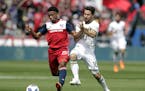 FC Dallas's Jacori Hayes (15) and Portland Timbers's Sebastian Blanco (10) compete for a loose ball during an MLS soccer match on March 24, 2018 in Fr