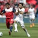 FC Dallas's Jacori Hayes (15) and Portland Timbers's Sebastian Blanco (10) compete for a loose ball during an MLS soccer match on March 24, 2018 in Fr