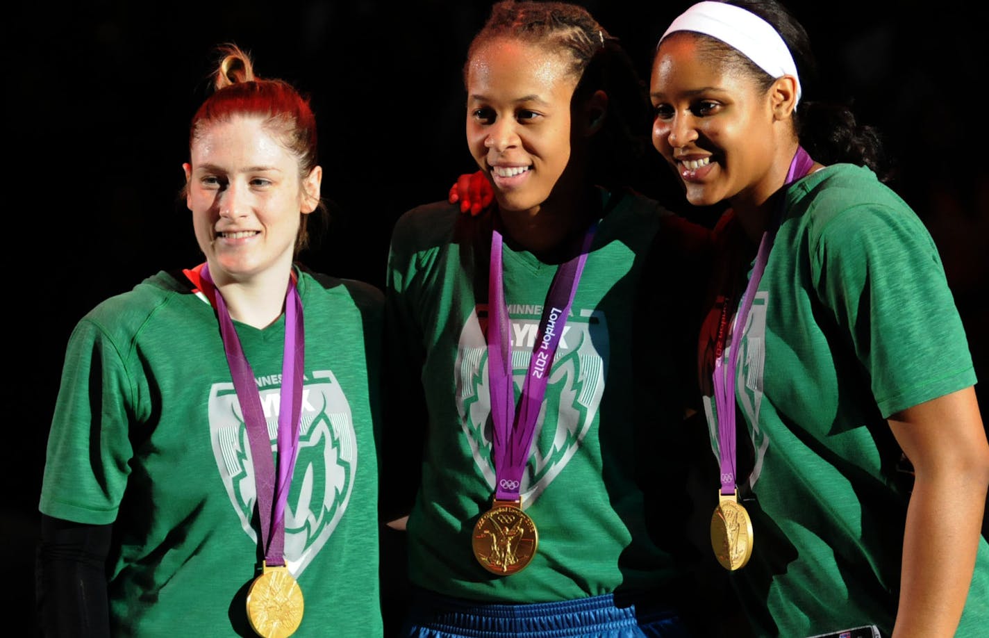 The Minnesota Lynx hosted the Washington Mystics at Target Center August 17, 2012, to kick off the second half of the season. Before the star of the game the 3 Lynx gold medalist were honored at center court they are from l to right Lindsay Whalen , Seimone Augustus and Maya Moore ] Richard.Sennott@startribune.com Richard Sennott /Star Tribune. , Minneapolis, Minn. Friday 08/17/12) ** (cq) ORG XMIT: MIN1208172202011090