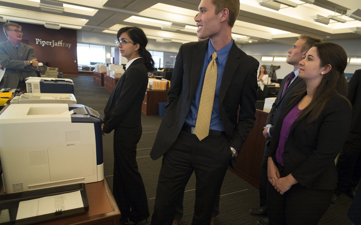 At Piper Jaffray headquarters in downtown Minneapolis, St. Olaf students interested in breaking into the world of finance got a tour of the trading floor and introduction to finance from Jon Salveson is vice chairman of investment banking at Piper Jaffray. He&#x2019;s also a member of the board of regents of St. Olaf College, and a 1987 graduate of St. Olaf. St. Olaf students include, left to right, Kelly Montoya, Erik Springer, and Sara Anderson . ] Richard Tsong-Taatarii/rtsong-taatarii@startr