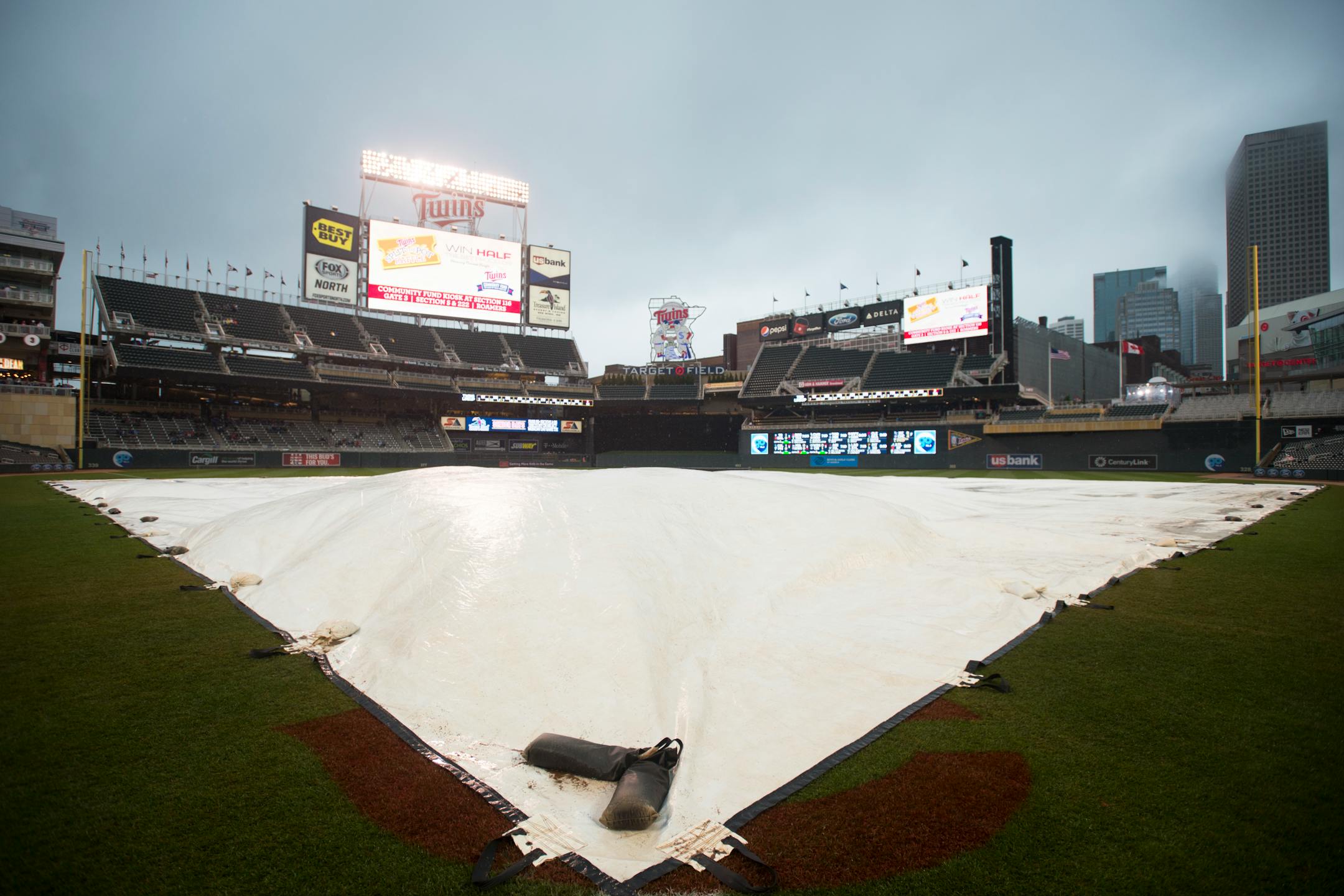 The rain tarp covered the infield just before the scheduled start of Friday night's Twins game against the Toronto Blue Jays. ] Aaron Lavinsky � aaron.lavinsky@startribune.com The Minnesota Twins played the Toronto Blue Jays on Friday, May 29, 2015 at Target Field in Minneapolis, Minn.