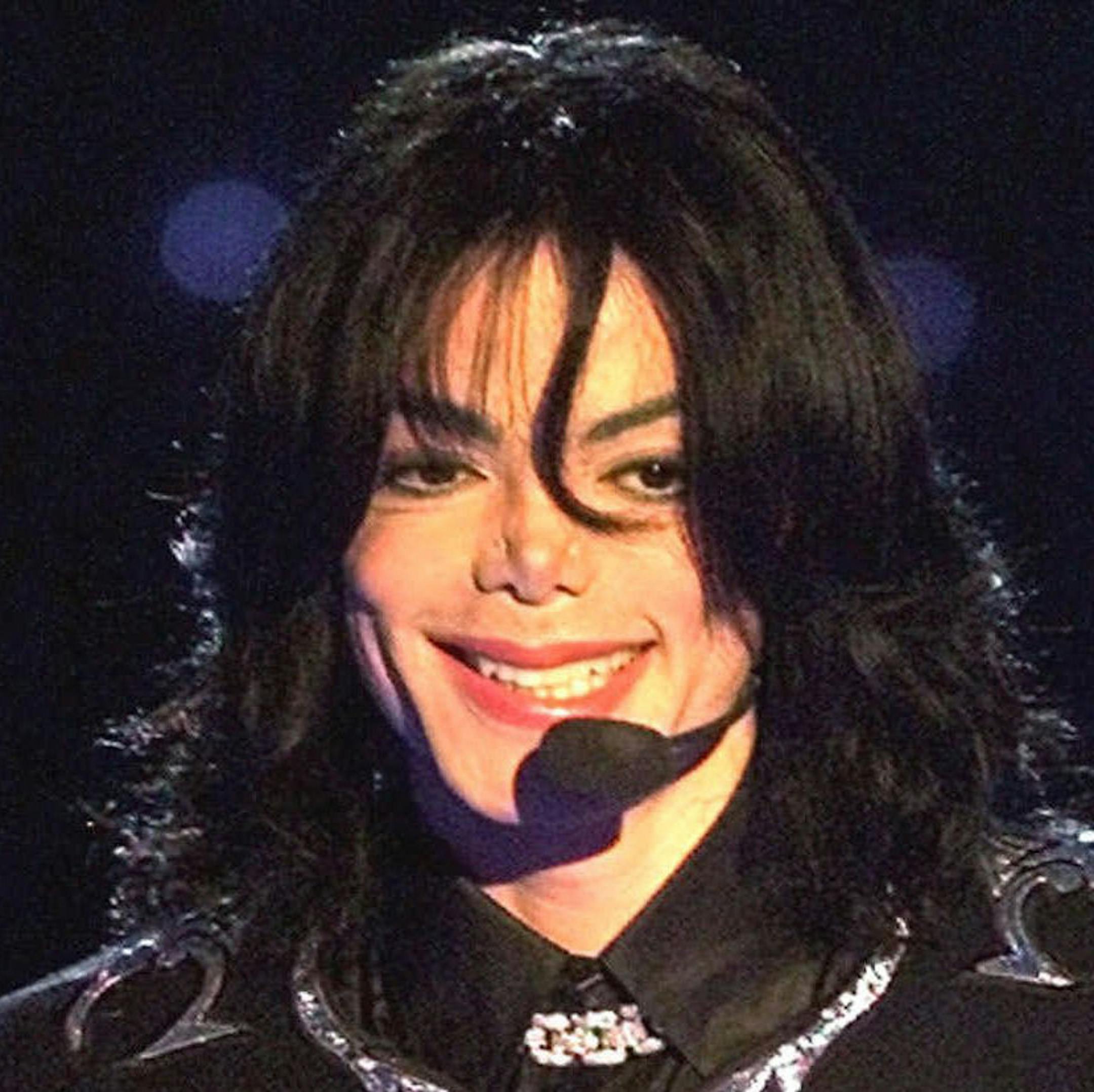 FILE - In this May 10, 2000 file photo, pop star Michael Jackson gestures to spectators as he holds the "Millennium Award" which was awarded to him at the 2000 World Music Awards ceremony in Monaco. Testimony concluded on Friday, Sept. 20, 2013, in the 21st week of a Los Angeles civil trial filed by Jacksonís mother against concert giant AEG Live LLC, which she claims is liable for her sonís death. AEG denies any wrongdoing in the case, which focuses on whether the company hired Conrad