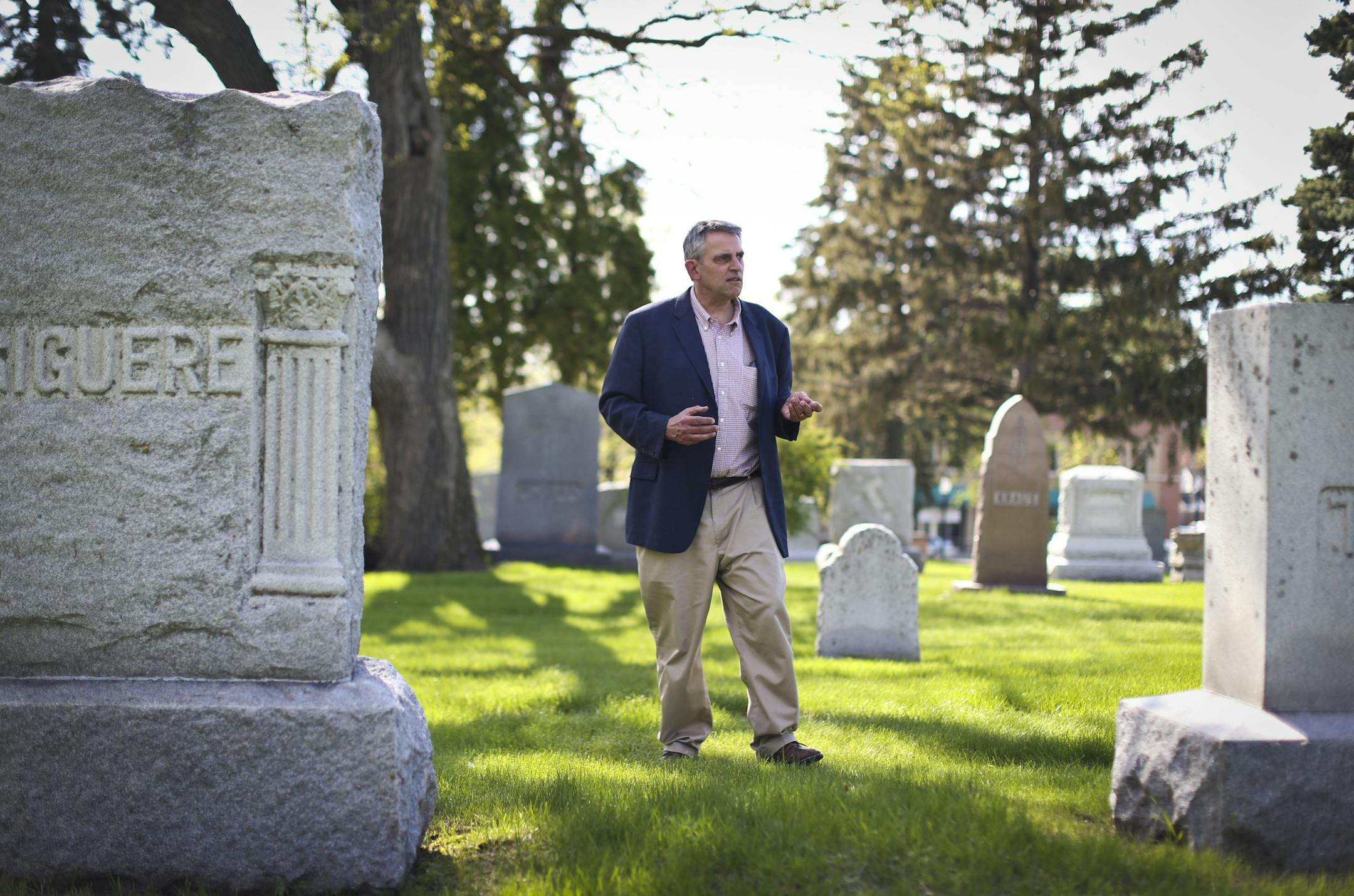 Author James Silas Rogers walked through St. Mary's Cemetery on Tuesday, May 20, 2014, in Minneapolis, Minn. ] RENEE JONES SCHNEIDER ‚Ä¢ reneejones@startribune.com