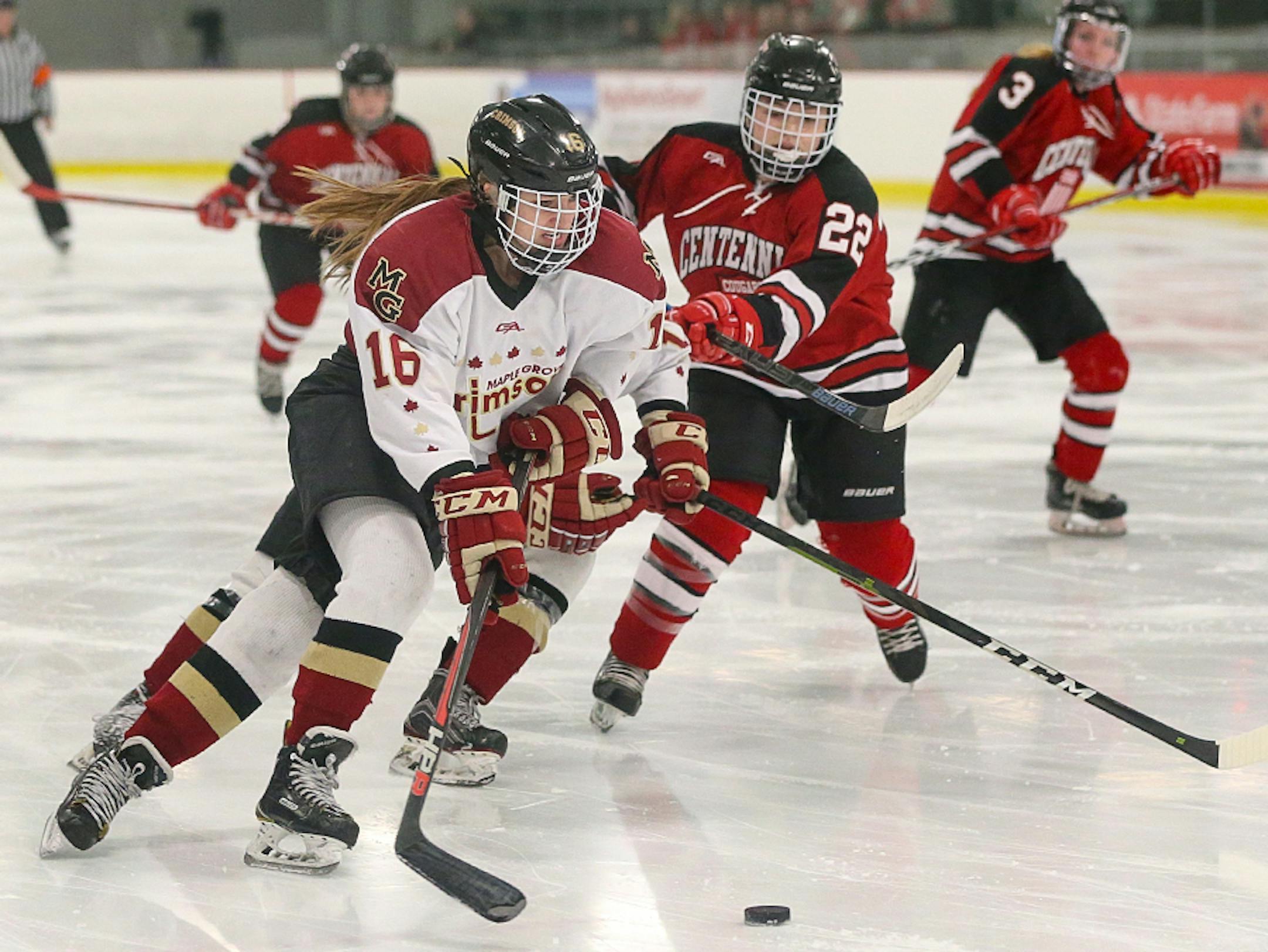 Maple Grove Lauren Stenslie (16) beats Centennial defender McKenna Gulner (22) to the puck. Stenslie scored the Crimson's winning goal early in the third period in a 4-1 win in the Class 2A, Section 5 championship game. Photo by Cheryl Myers, SportsEngine
