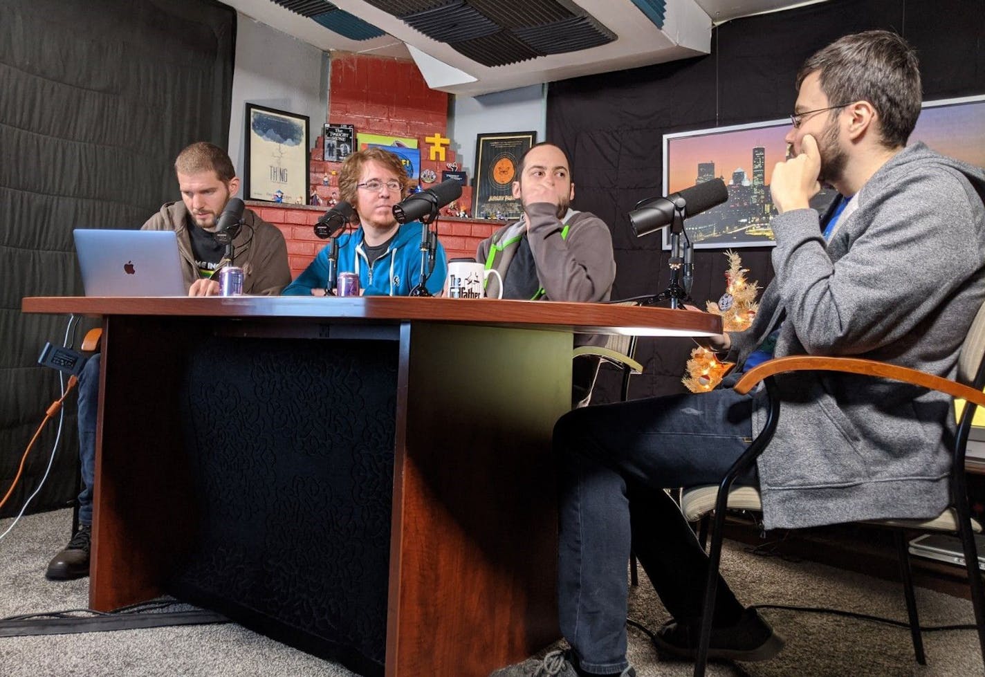 Former "Game Informer" employees Ben Hanson, Kyle Hilliard, Jeff Marchiafava and Suriel Vazquez record their weekly gaming podcast "The MinnMax Show" in Hanson's basement.
Photo by Nicole Norfleet