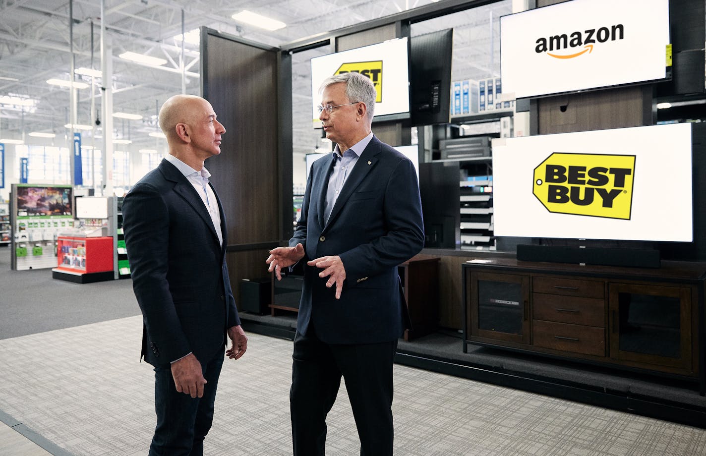 Best Buy CEO Hubert Joly and Amazon's Jeff Bezos came together Tuesday to discuss the deal. (Business Wire) ORG XMIT: 1228920