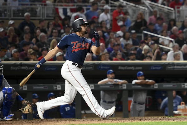 Minnesota Twins center fielder LaMonte Wade Jr. (30) hit a triple in the bottom of the fifth inning Saturday against the Kansas City Royals. ] Aaron L