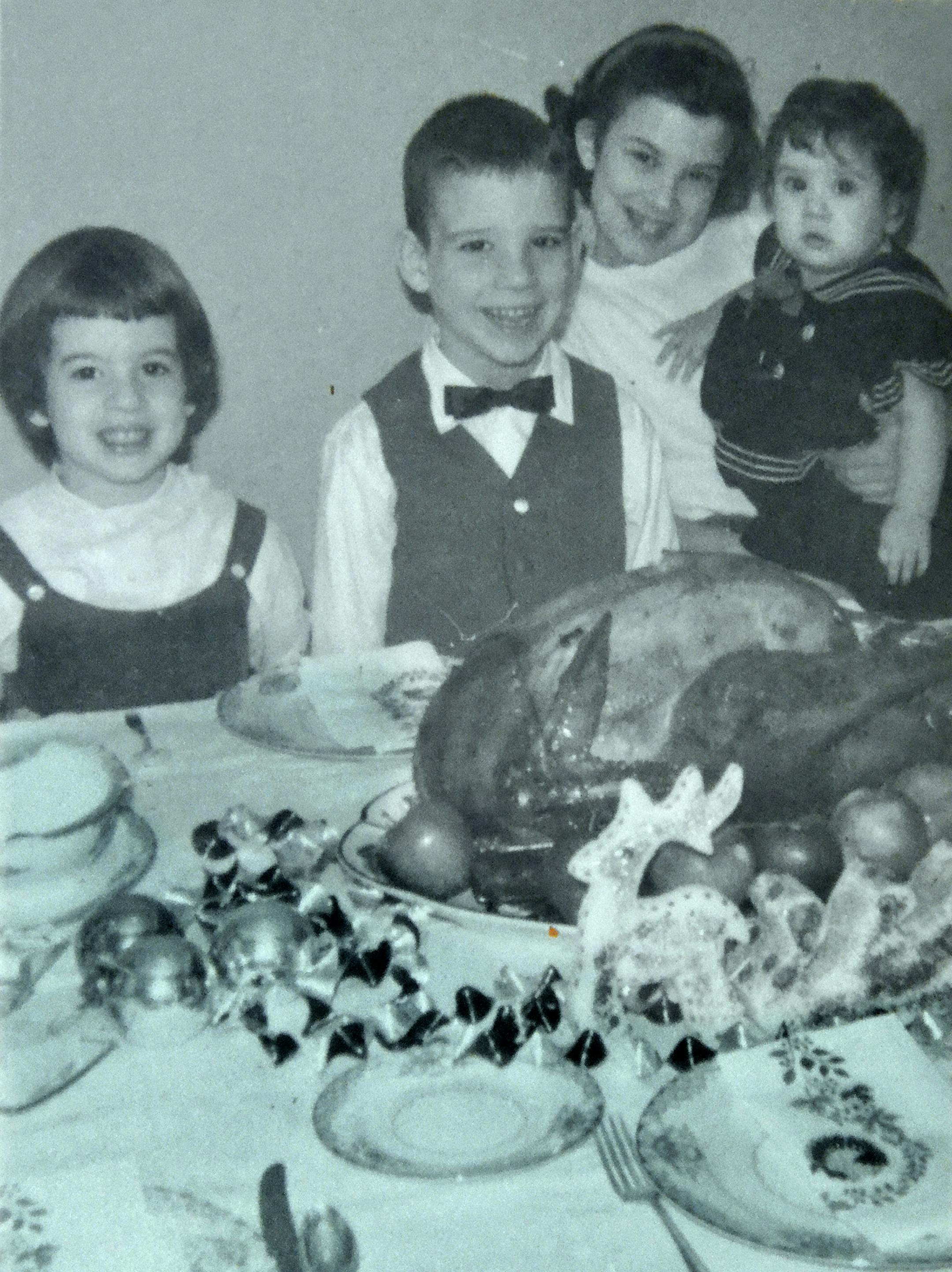 This 1963 photo shows Mary Protas (left) and her siblings eating Thankgsiving dinner on their grandmother’s china.