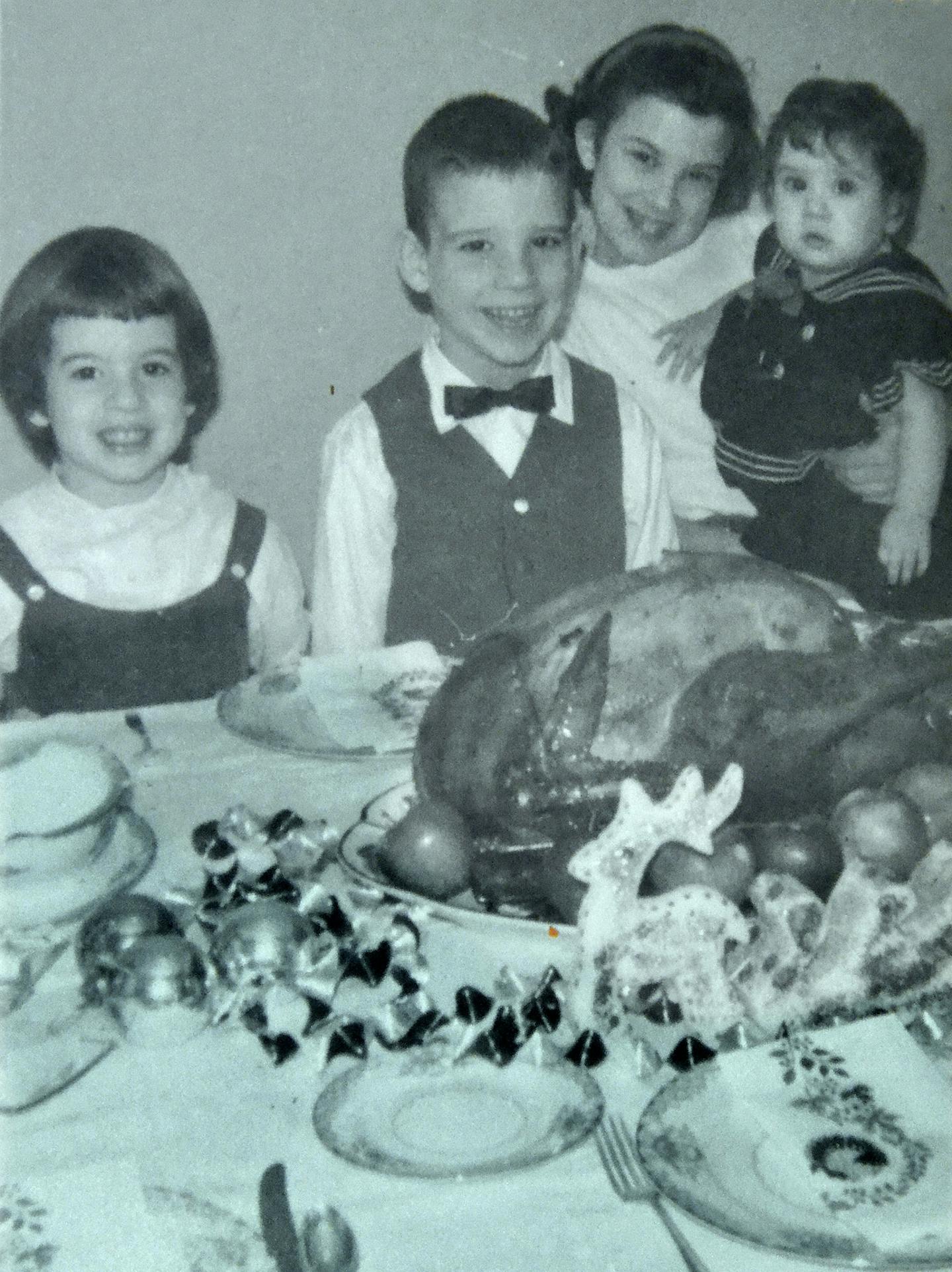 This 1963 photo shows Mary Protas (left) and her siblings eating Thankgsiving dinner on their grandmother&#x2019;s china.