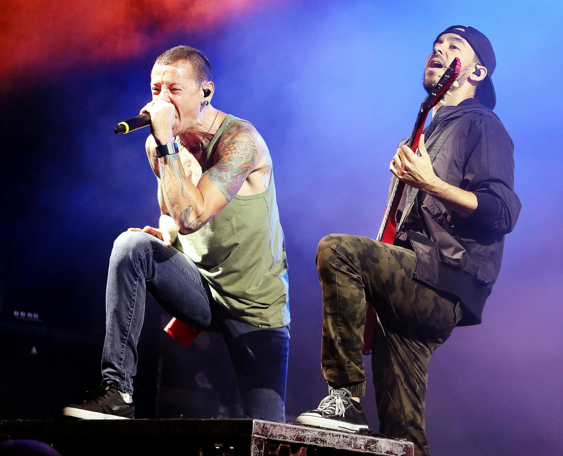 Chester Bennington, from left, and Mike Shinoda of the band Linkin Park perform in concert during their ìCarnivores Tour 2014î at the Susquehanna Bank Center on Friday, Aug. 15, 2014, in Camden, N.J. (Photo by Owen Sweeney/Invision/AP)