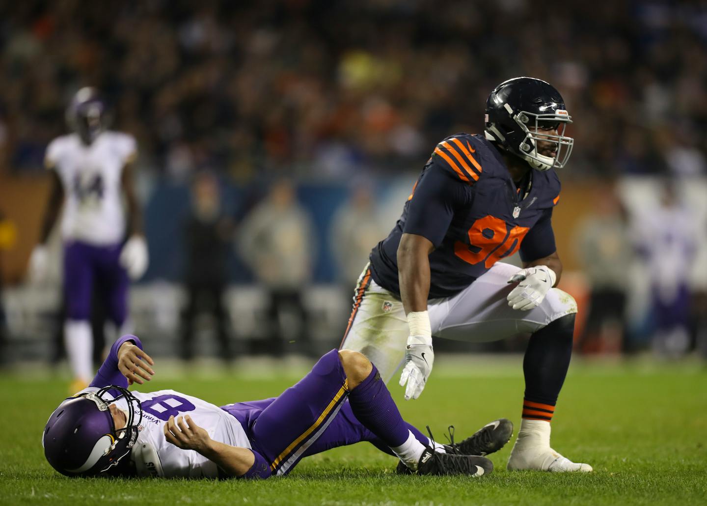 Chicago Bears defensive end Cornelius Washington (90) dropped Vikings quarterback Sam Bradford (8) to the turf after he got rid of the ball in the third quarter.