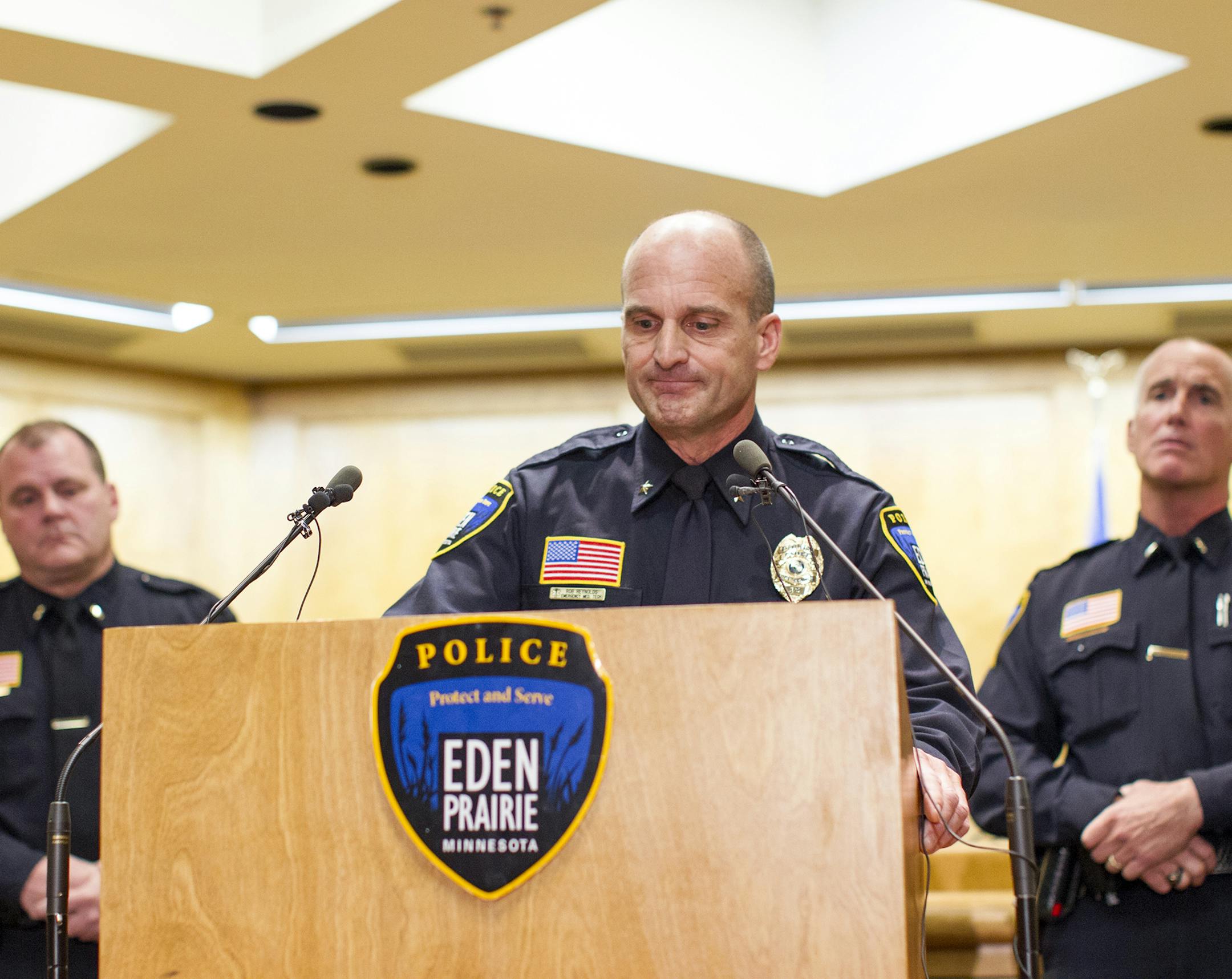 Eden Prairie Police Chief Rob Reynolds, center, pauses with emotion after confirming that Mandy Matula's body was found at a press conference at Eden Prairie City Council Chambers October 27, 2013. (Courtney Perry/Special to the Star Tribune)