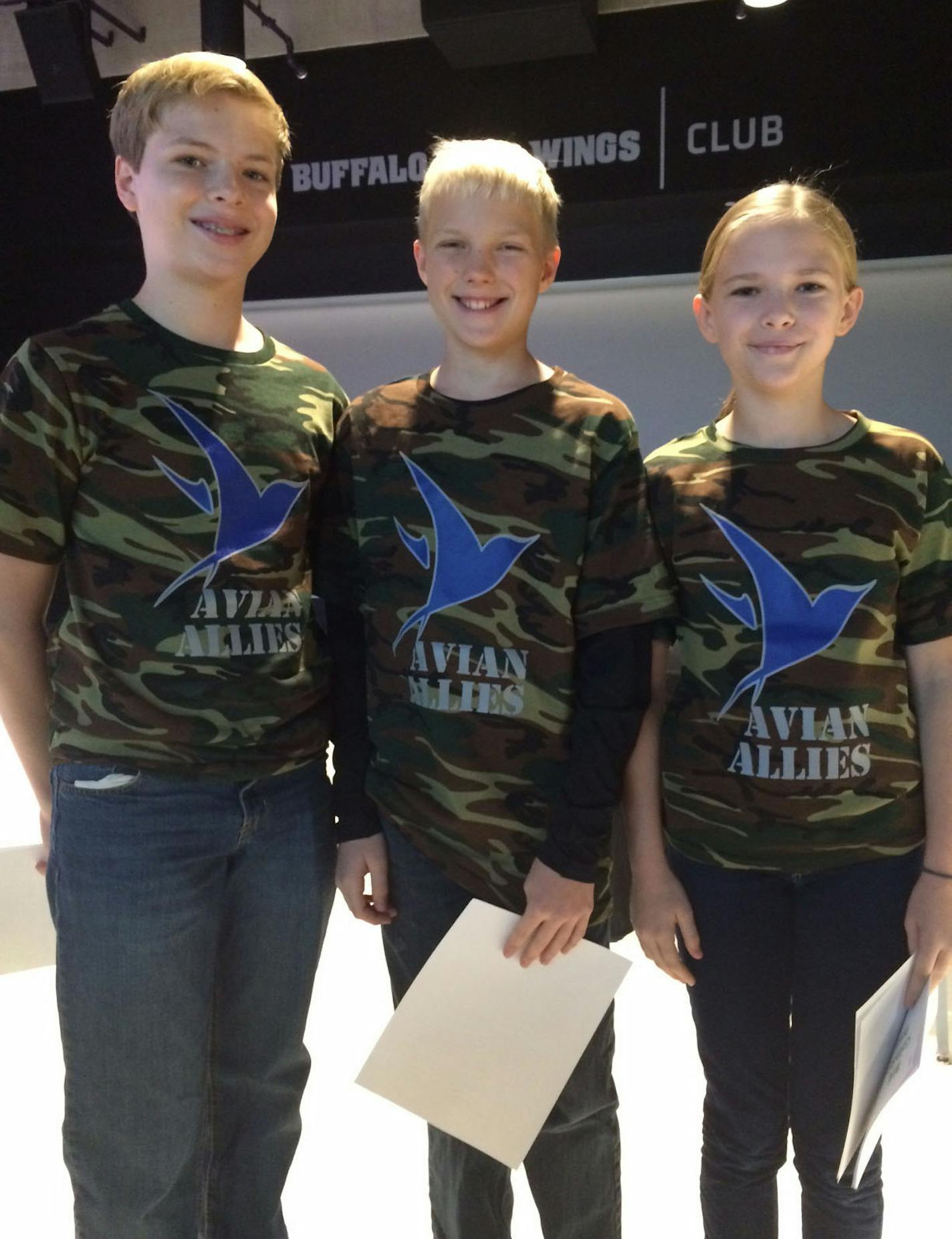 (Left to right) Three Twin Cities middle school students, Sam Dodd, Alex Schwaller and Elena Dodd, propose placing ultraviolet-infused plastic film on U.S. Bank Stadium&#xed;s glass to prevent bird collisions and fatalities. ORG XMIT: MIN1611181219370814