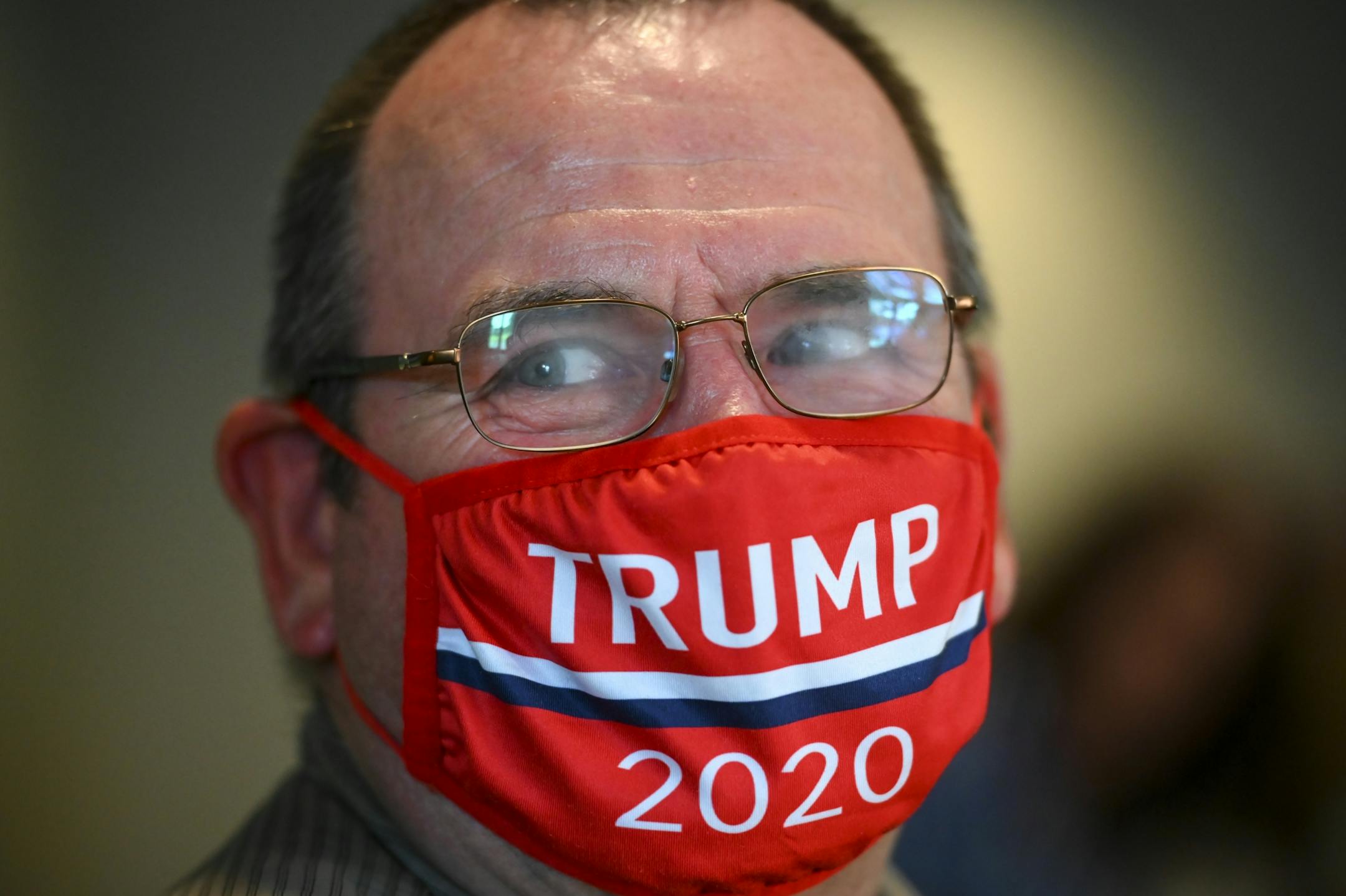 The glasses of Andy Carlson, of Darwin, Minn., fogged up as he joked with friends at Tuesday night's CD-7 Republican watch part at Max's Grill and Sheep Shedde Inn in Olivia, Minn. Carlson works in the dairy industry and hopes that Trump's reelection would lead to "continued improvement of trade agreements."