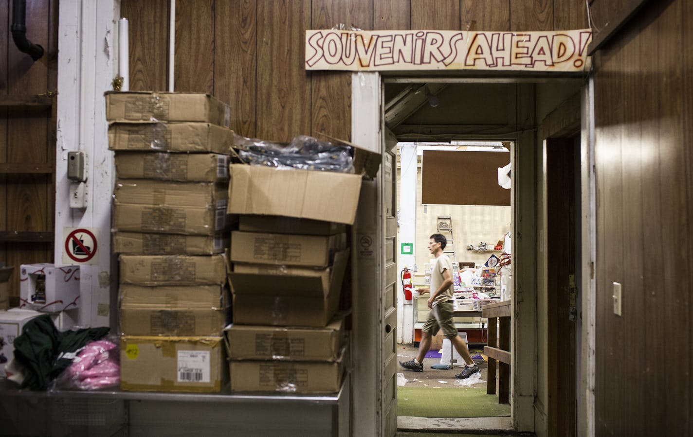 Ray Crump, Jr., president and son of Dome Souvenirs owner Ray Crump, packs up the merchandise at Dome Souvenirs in downtown Minneapolis on Friday, August 28, 2015. ] LEILA NAVIDI leila.navidi@startribune.com / BACKGROUND INFORMATION: Dome Souvenirs, the longtime sporting goods shop across from the former Metrodome, is moving to St. Louis Park.