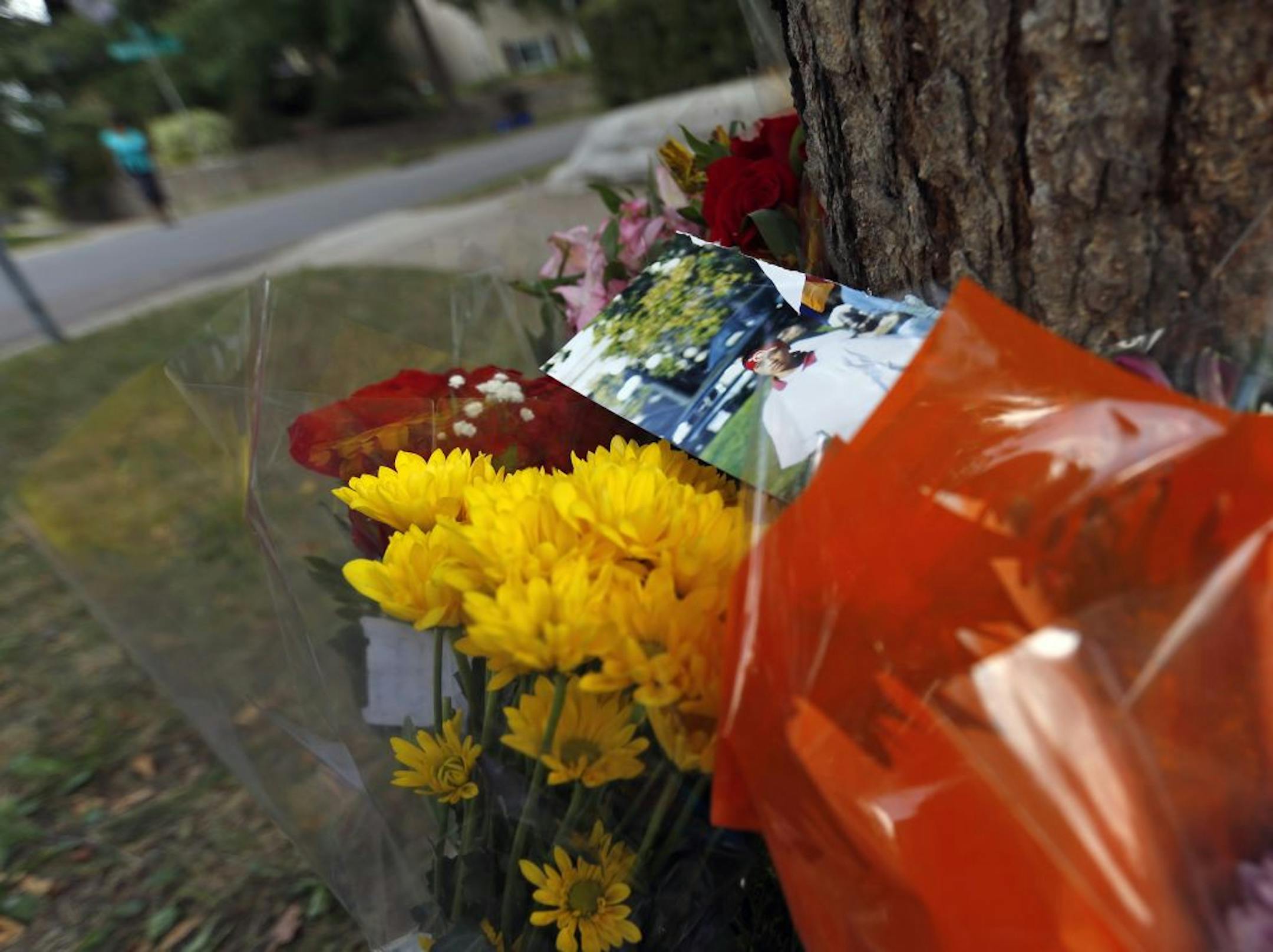 A makeshift memorial last August on the corner of Cypress Street and Wakefield Avenue in St. Paul honored Aung Thu Bo.