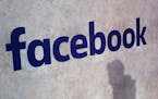 FILE - This Jan. 17, 2017, file photo shows a Facebook logo being displayed in a start-up companies gathering at Paris' Station F, in Paris. Facebook 