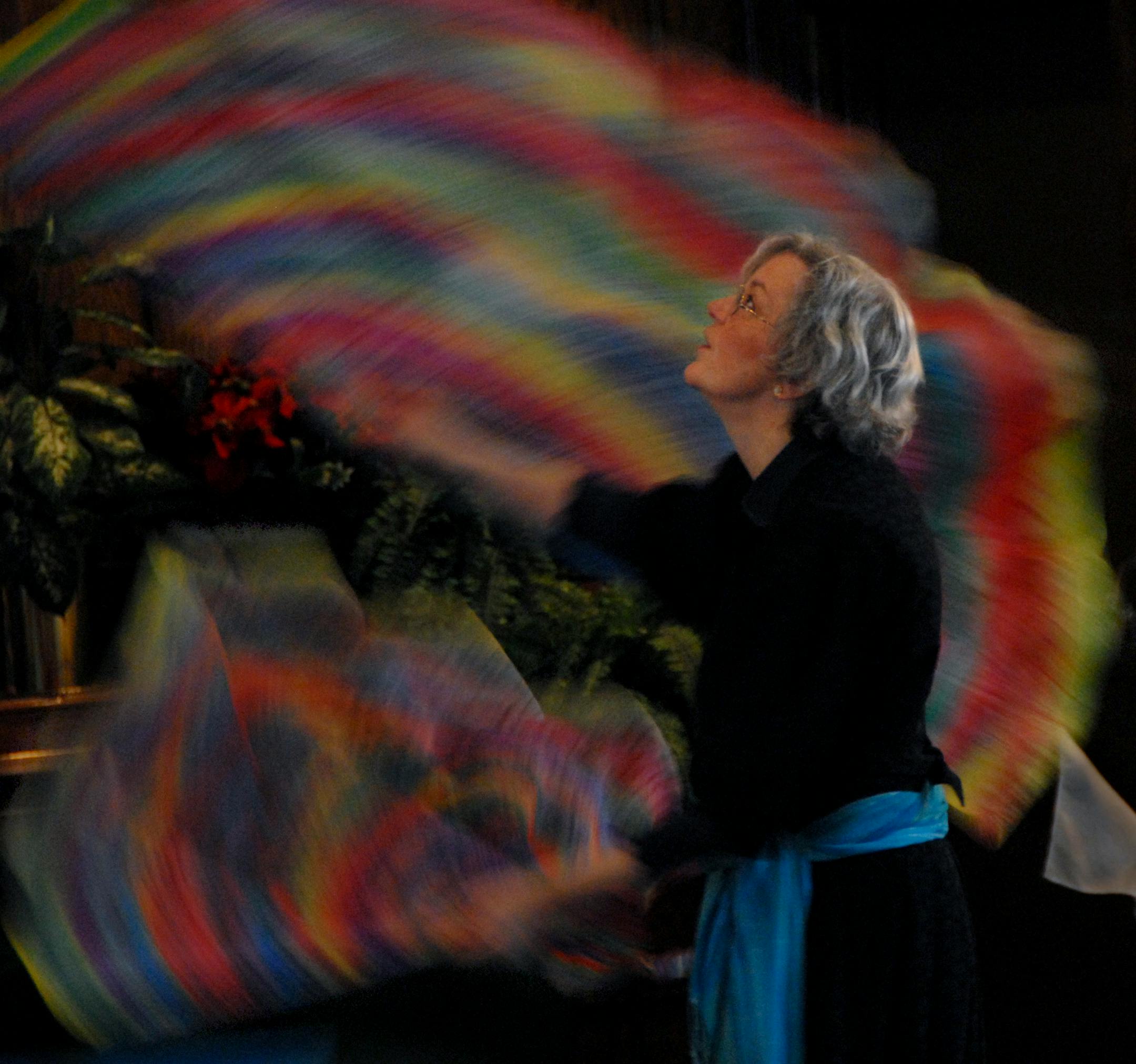 Sarah Barnes waved "angel wings" with rainbow colors representing the promises of God during the Seed of Abraham Messianic Congregation service.