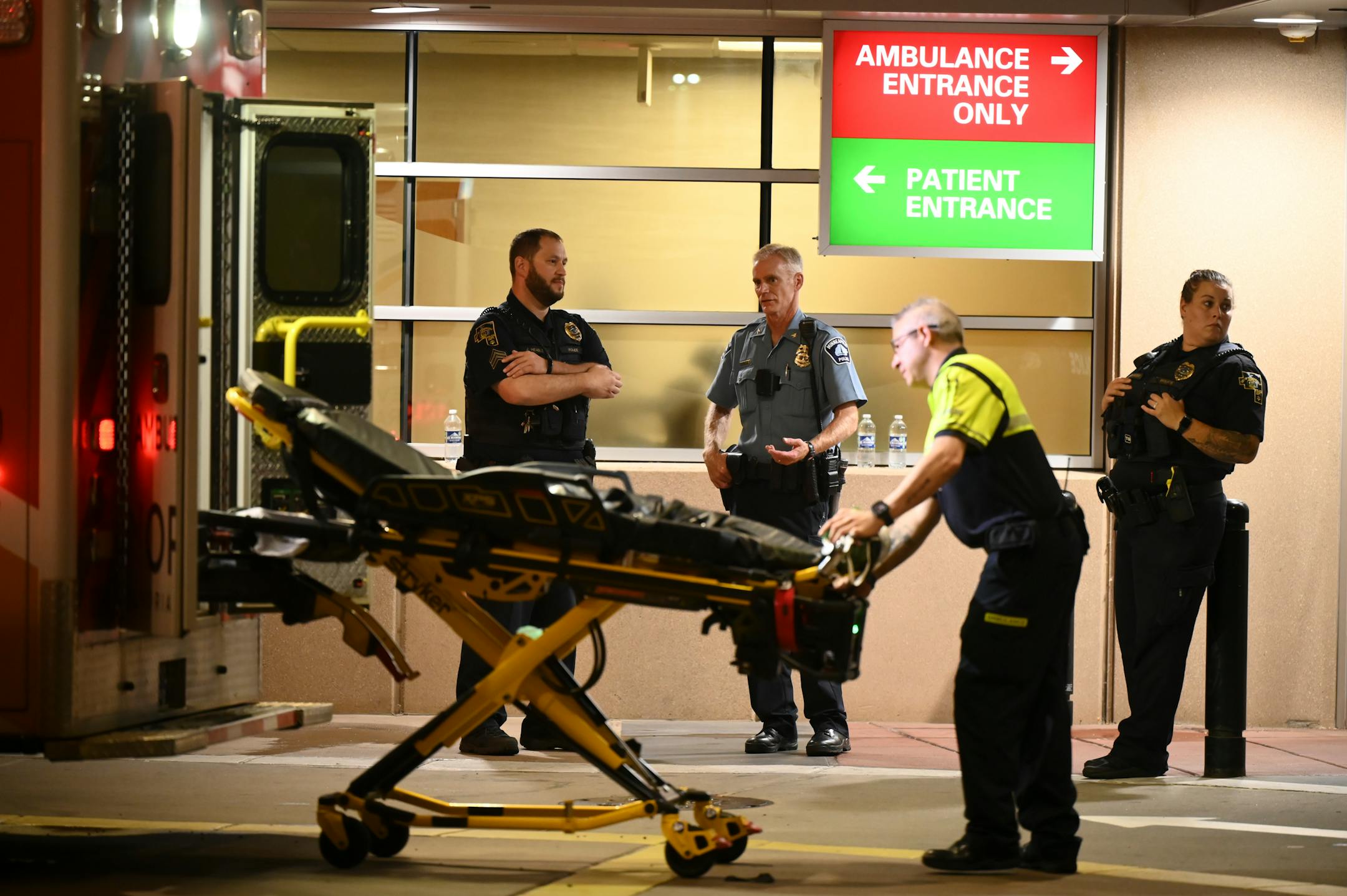 Newly-appointed Minneapolis Police 2nd Precinct Inspector Nicholas Torborg, left of center, talks with Robbinsdale Police outside North Memorial Hospital Friday, Aug. 11, 2023 in Robbinsdale, Minn. ] AARON LAVINSKY • aaron.lavinsky@startribune.com