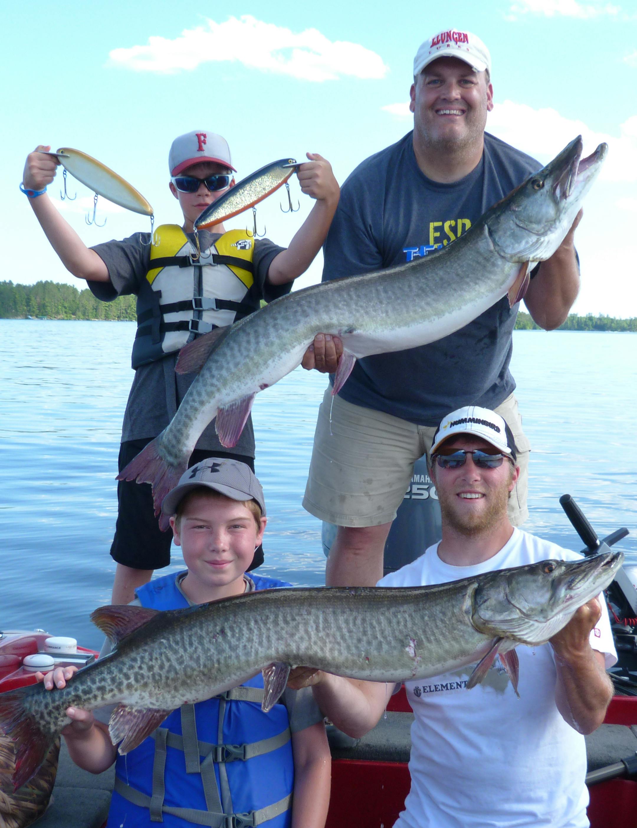 Muskie mania: Top, Jackson Utermarck of Fairmont, Minn., (left) and Rany Soma of Brookings, S.D., with a 51.5 inch muskie. Bottom: Braeden Lueders of Brookings, S.D., (left) and guide Matt Seifert of the Twin Cities.