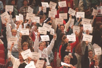 The last time the Women’s Final Four came to Minneapolis, in 1995, members and supporters of the Women’s Basketball Coaches Association held signs