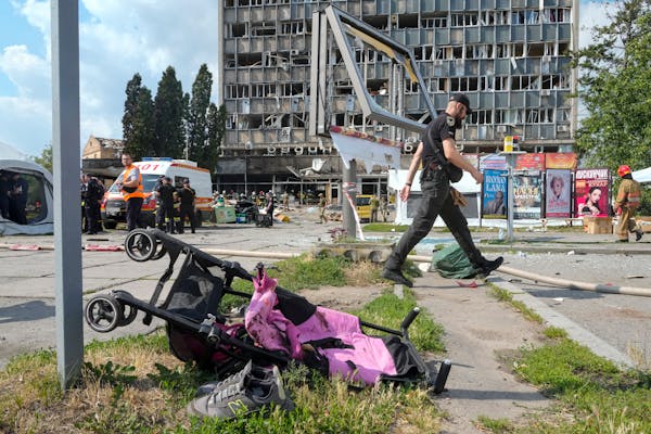 A baby stroller lay by a road after a deadly Russian missile attack in Vinnytsia, Ukraine, Thursday, July 14, 2022.