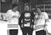 Don Brose holds Minnesota State’s 1980 NCAA Division II men’s hockey trophy with captain Steve Forliti (left) and Steve Loomis (right).