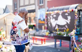 Kingsley Safo from Accra, Ghana, pays his respects at George Floyd Square in Minneapolis on Sunday, May 25, 2025.