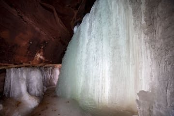 A cave and ice formation nicknamed "big blue" is considered the most impressive of the formations on Red Cliff Point.