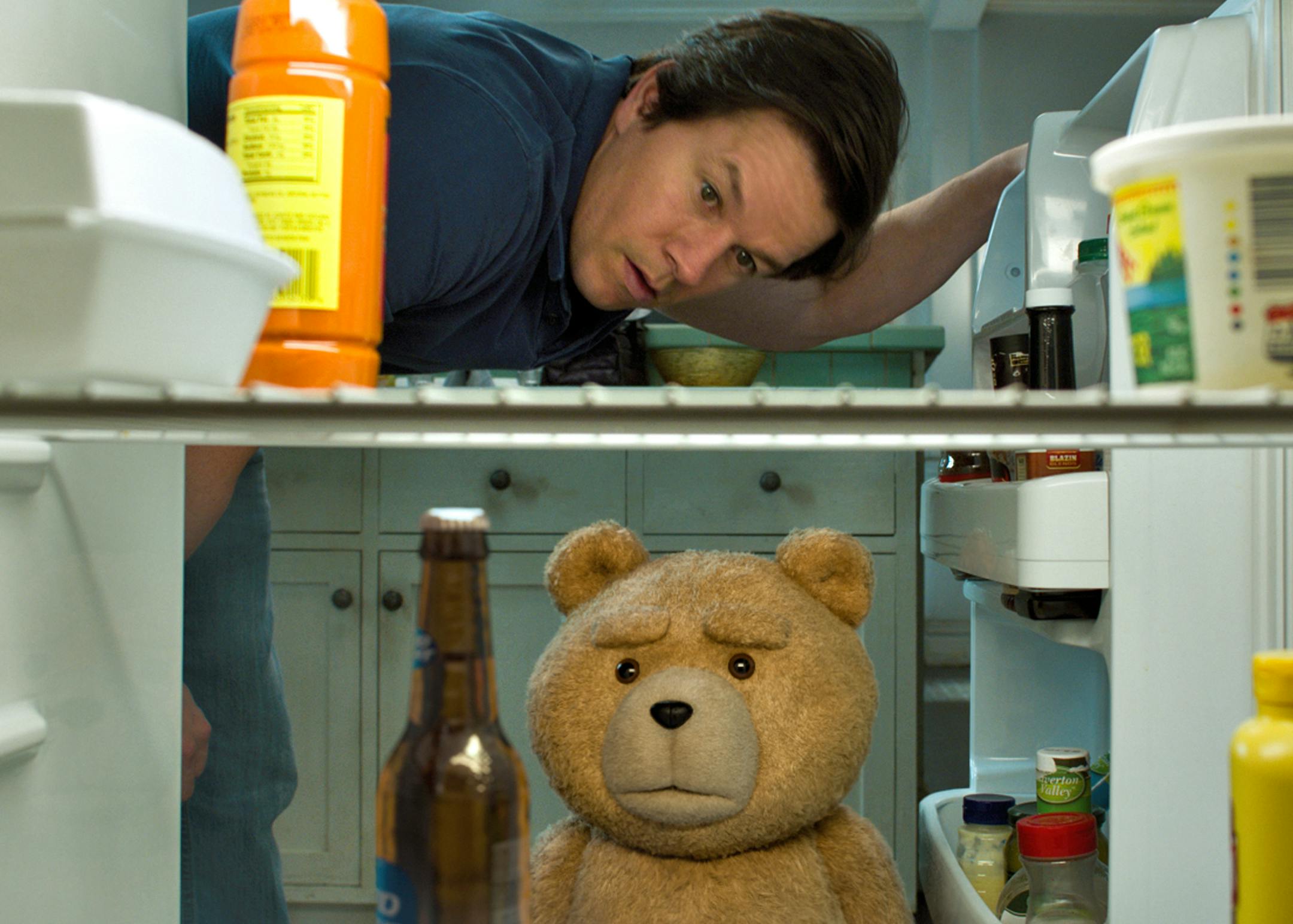 In this image released by Universal Pictures, the character Ted, voiced by Seth MacFarlane, bottom, and Mark Wahlberg appear in a scene from "Ted 2." (Universal Pictures via AP)