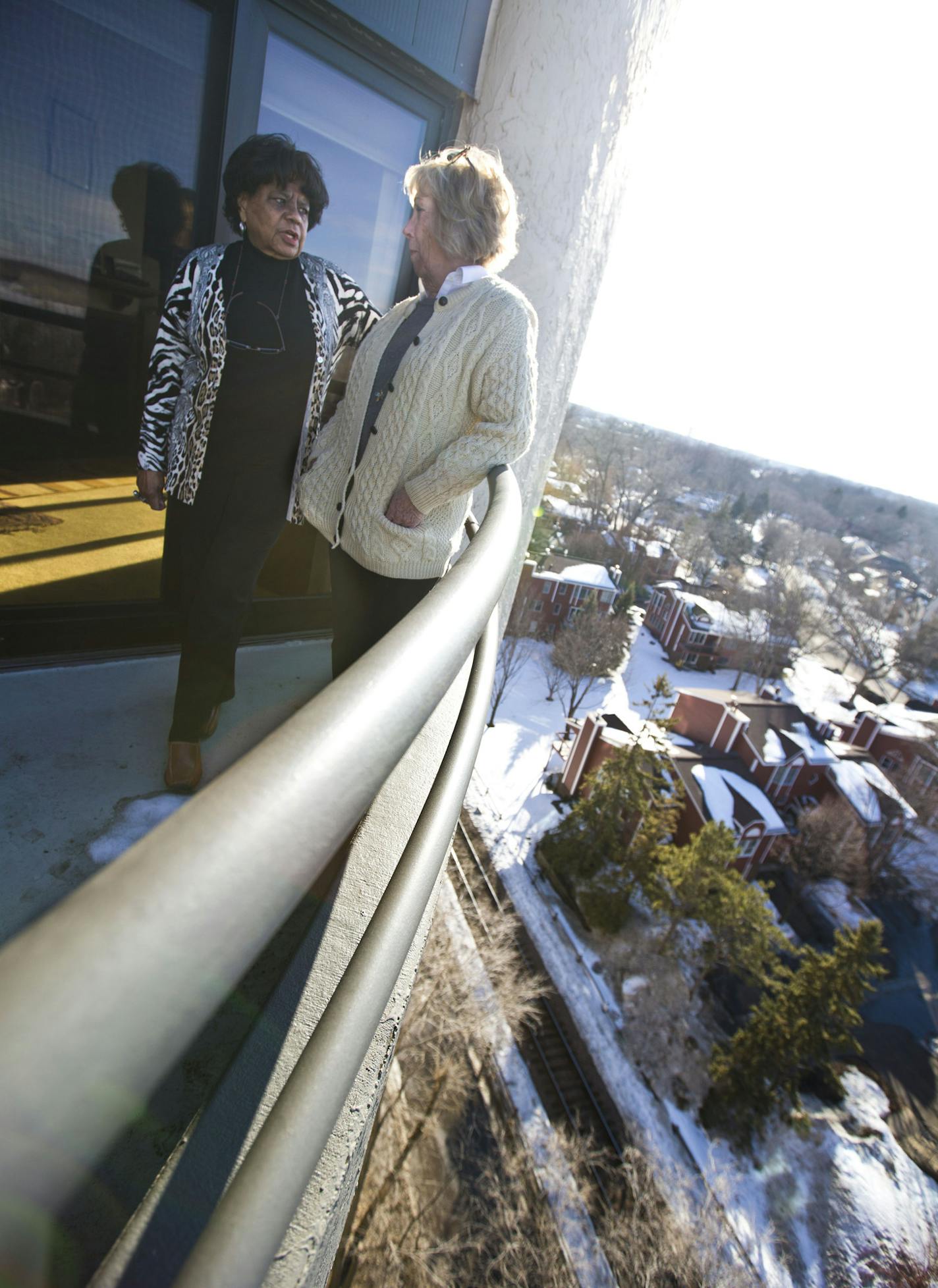 Calhoun Isles Condominium Association president Cherie Hamilton and board member Nancy Green stood on Hamilton's balcony that looks over the proposed line on the Kenilworth corridor in Minneapolis.