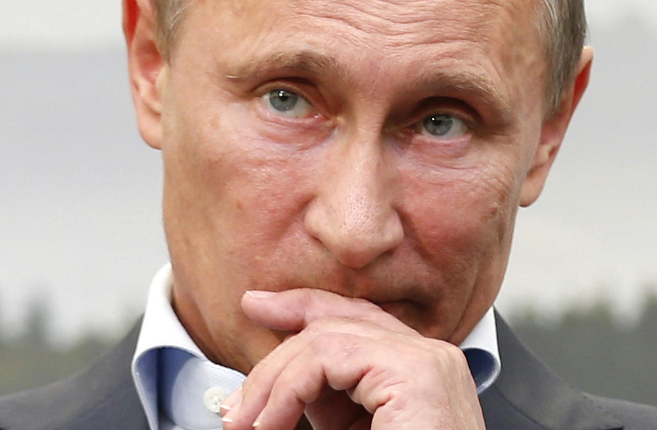 Russian President Vladimir Putin gestured while speaking during a media conference after a G-8 summit at the Lough Erne golf resort in Enniskillen, Northern Ireland, on Tuesday, the final day of the G-8 summit.