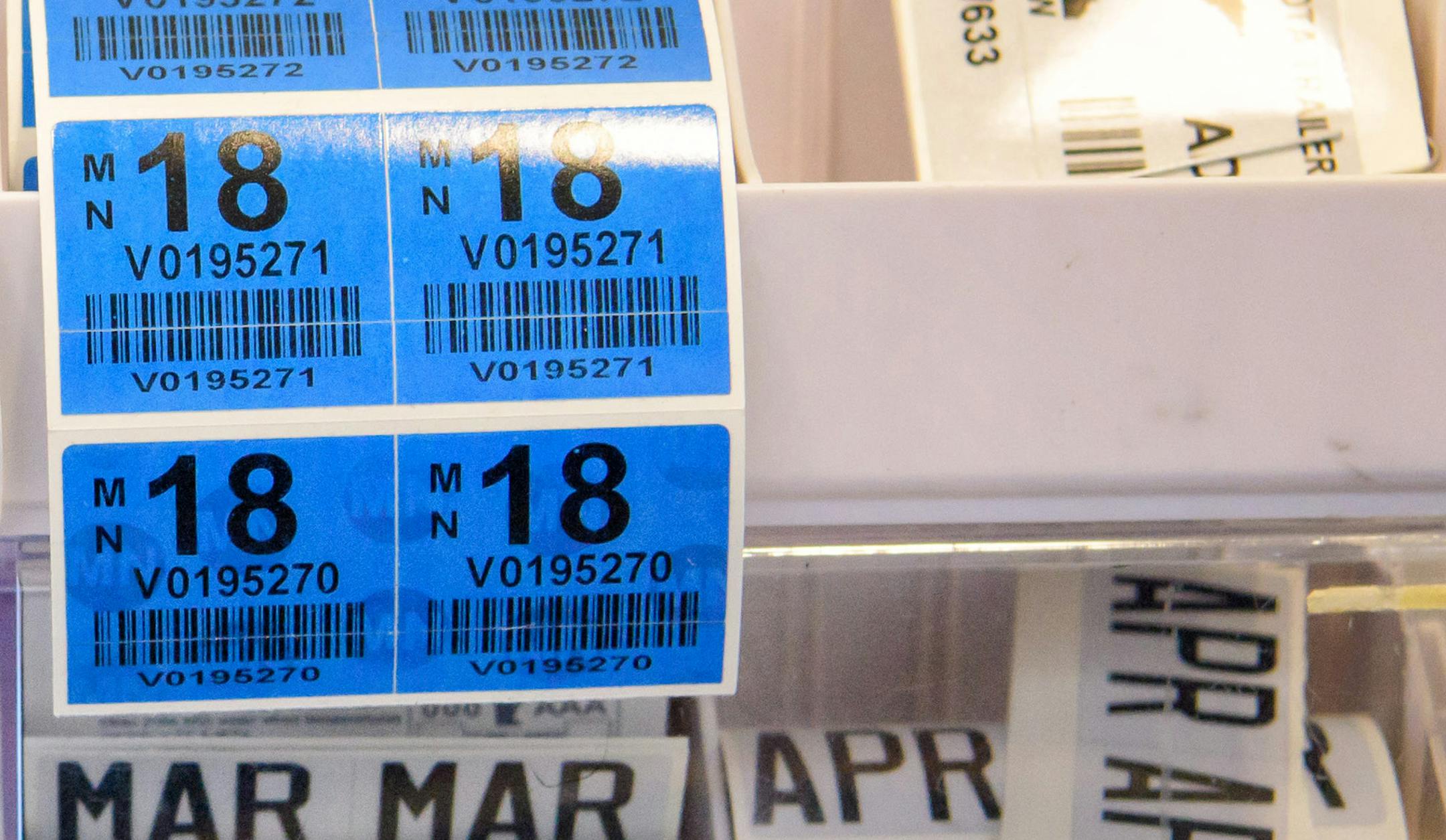 Miranda Sylvander helped Jacob Leverenz get a new set of vehicle license plates and tabs at the Carver County Service Center in Chanhassen. ] GLEN STUBBE * gstubbe@startribune.com Monday, August 22, 2016 Driv-thru service centers are popping up in the suburbs as a way to shortern wait time and ease up conjestion for tab renewals.