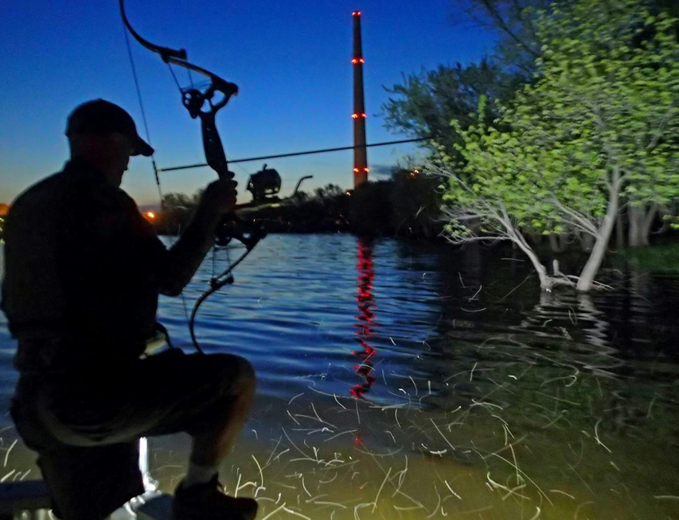 A bowfisherman cruised the St. Croix River shallows near the Allen S. King power plant in 2015. The plant could close in 2028, open a large tract of land with nearly a mile of riverfront for new uses.