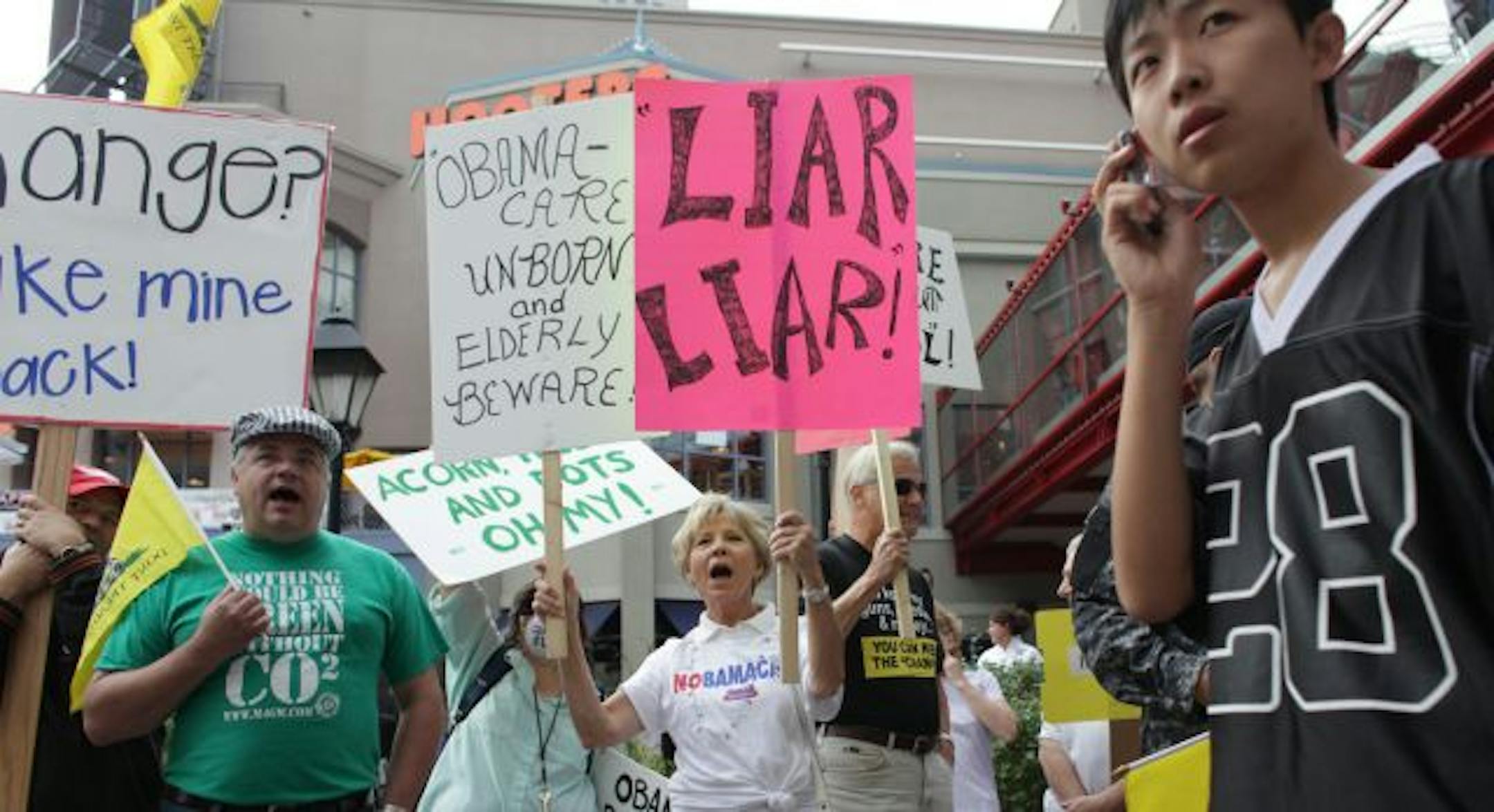 Protesters stood outside of the Target Center where President Obama was going to speak about health care.