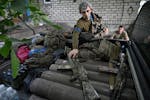 A mortar operator of the 47th Mechanised Brigade of Ukrainian Army prepares to go on a mission in Pokrovsk area, Donetsk region, on June 12, 2024, ami