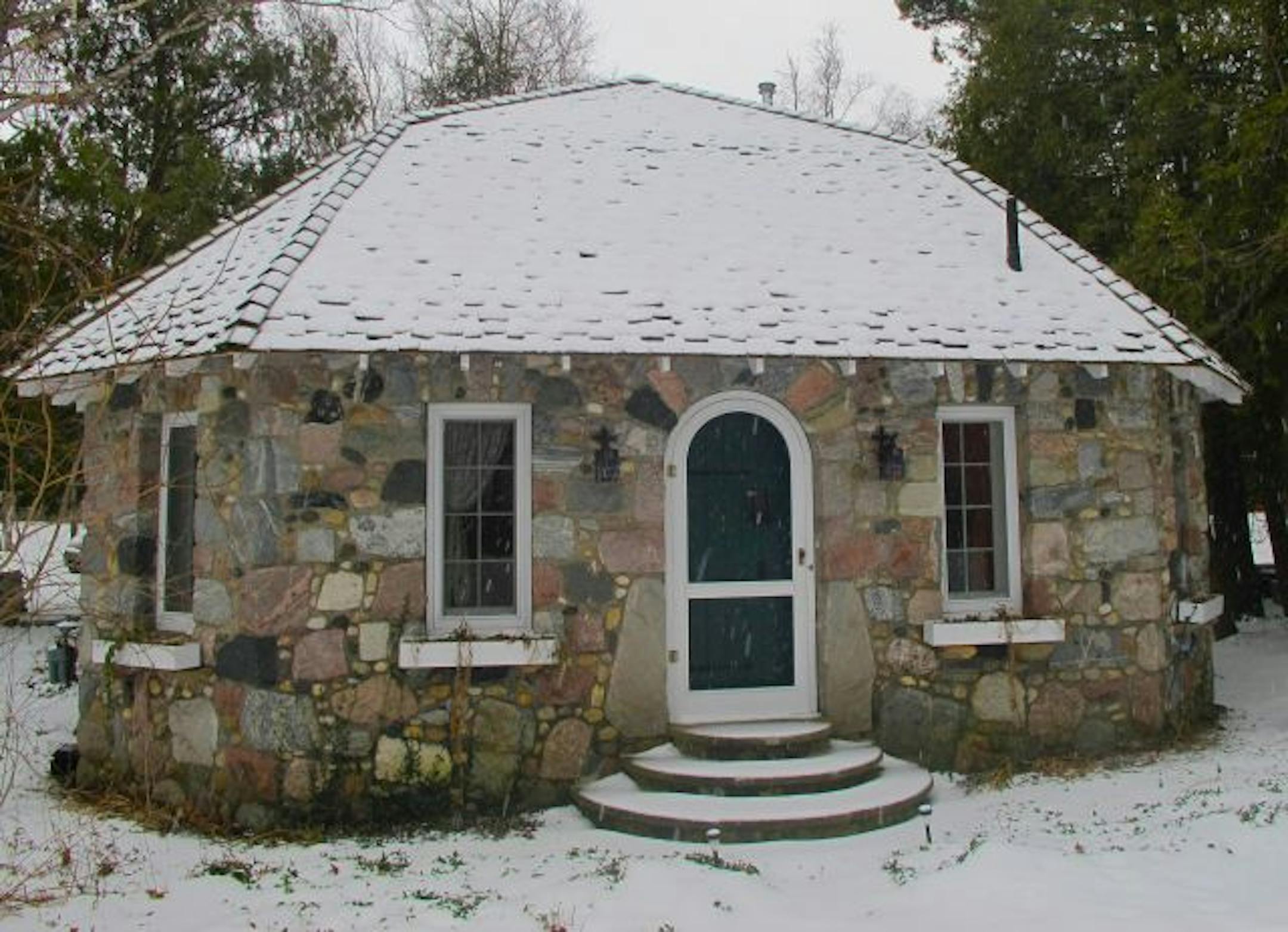 This diminutive 1936 Earl Young one-bedroom cottage is on the property of a larger home called the Panama House along Lake Michigan in Charlevoix, Michigan.